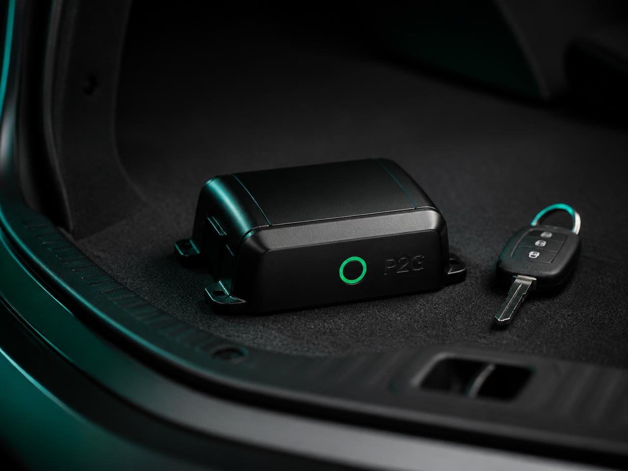 Prompt2Go Box mounted in a car trunk beside a car key